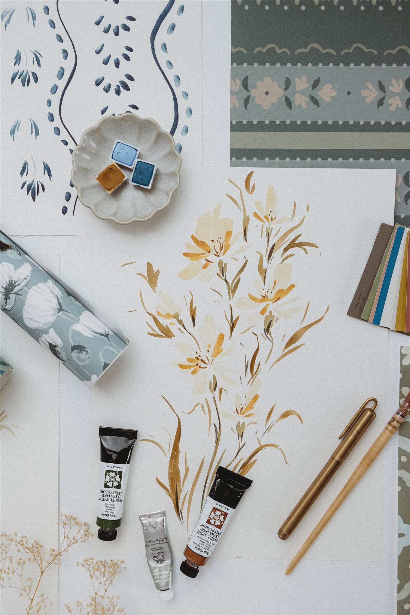 Flat lay of surface pattern design collections including botanical and floral repeat patterns
