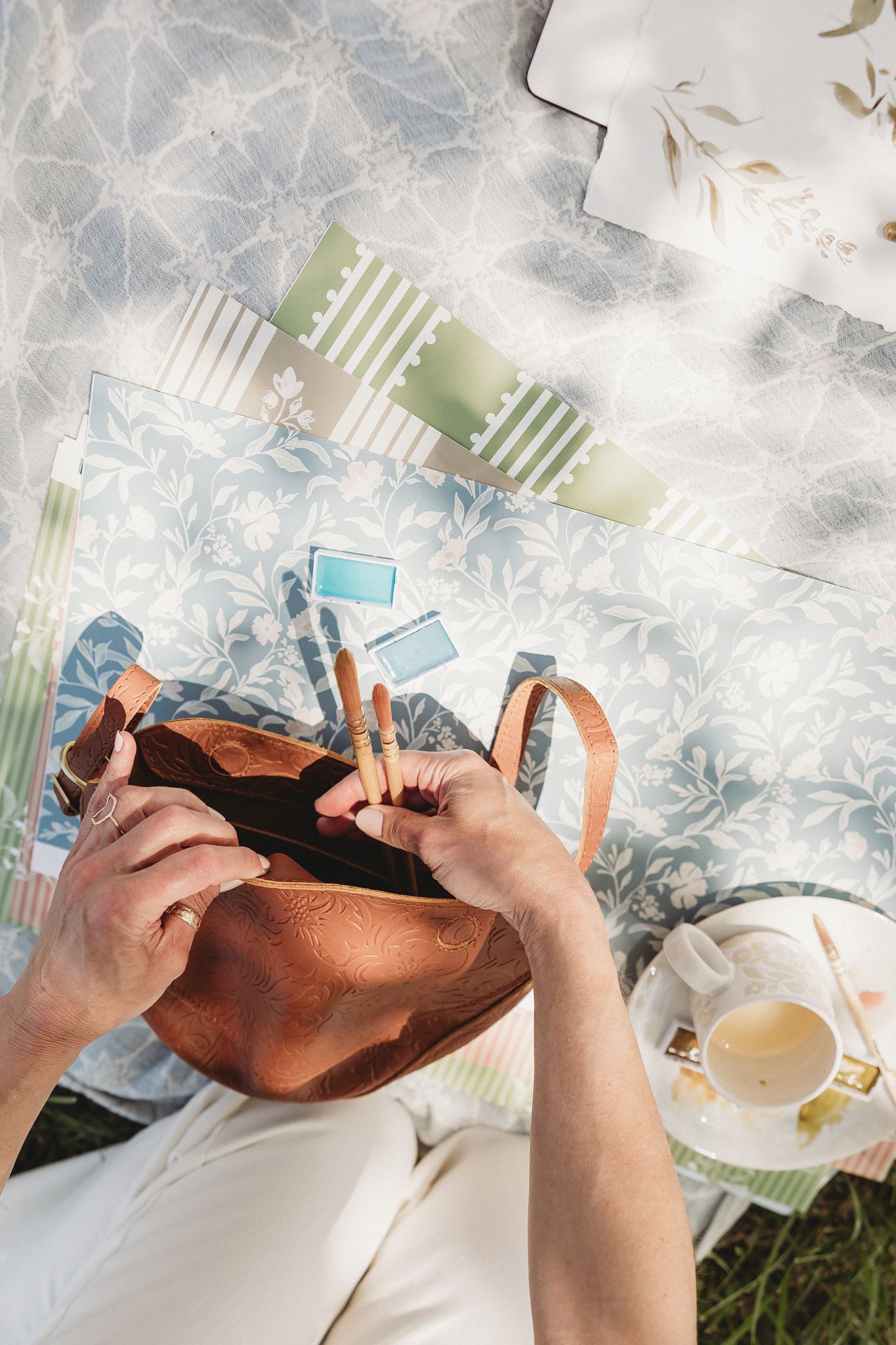 Painting on a picnic blanket