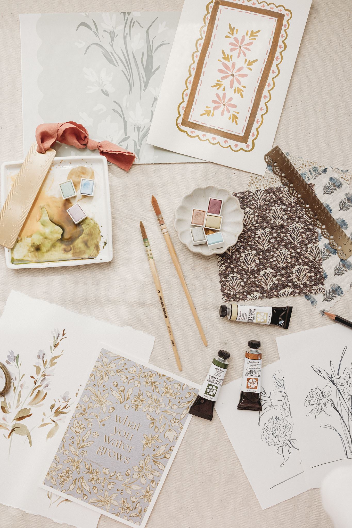 Paint, brushes, artwork and paint